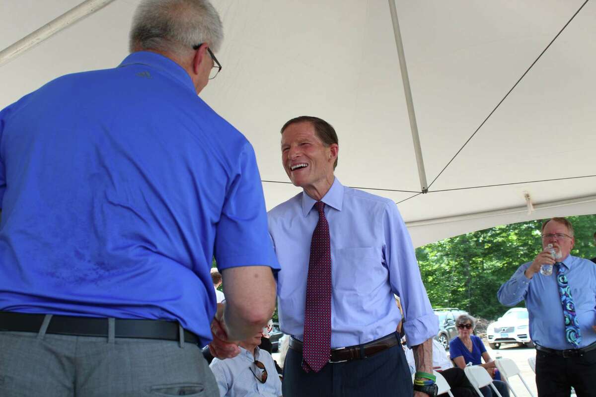 U.S. Sen. Richard Blumenthal, D-Conn., celebrates the groundbreaking of Great Pond Village in Windsor with town leaders.