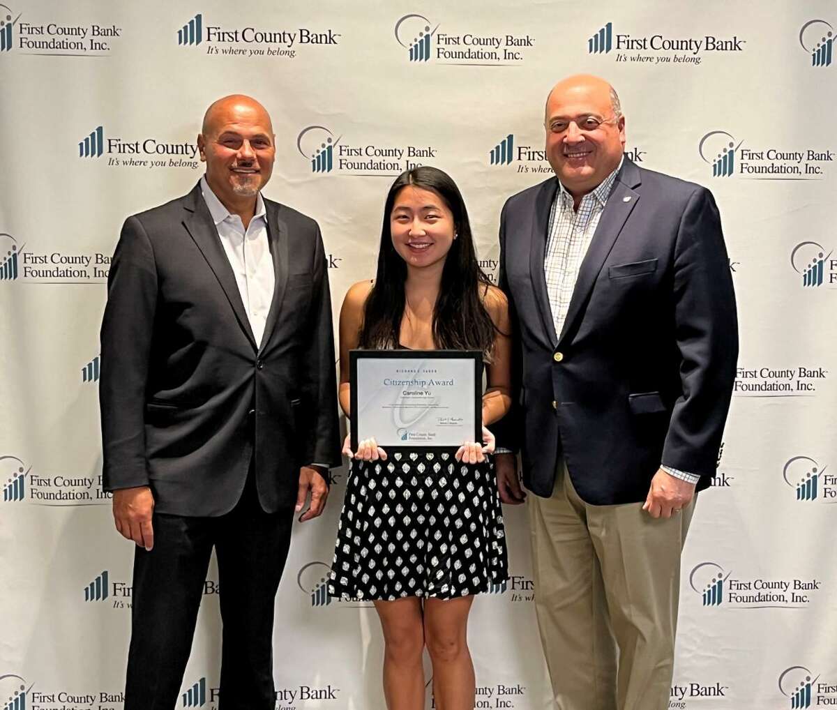 Caroline Yu of Greenwich, center, with Willard Miley, left, president and COO of First County Bank and vice president of First County Bank Foundation; amd Robert J. Granata, right, chairman and CEO of First County Bank and president of First County Bank Foundation.