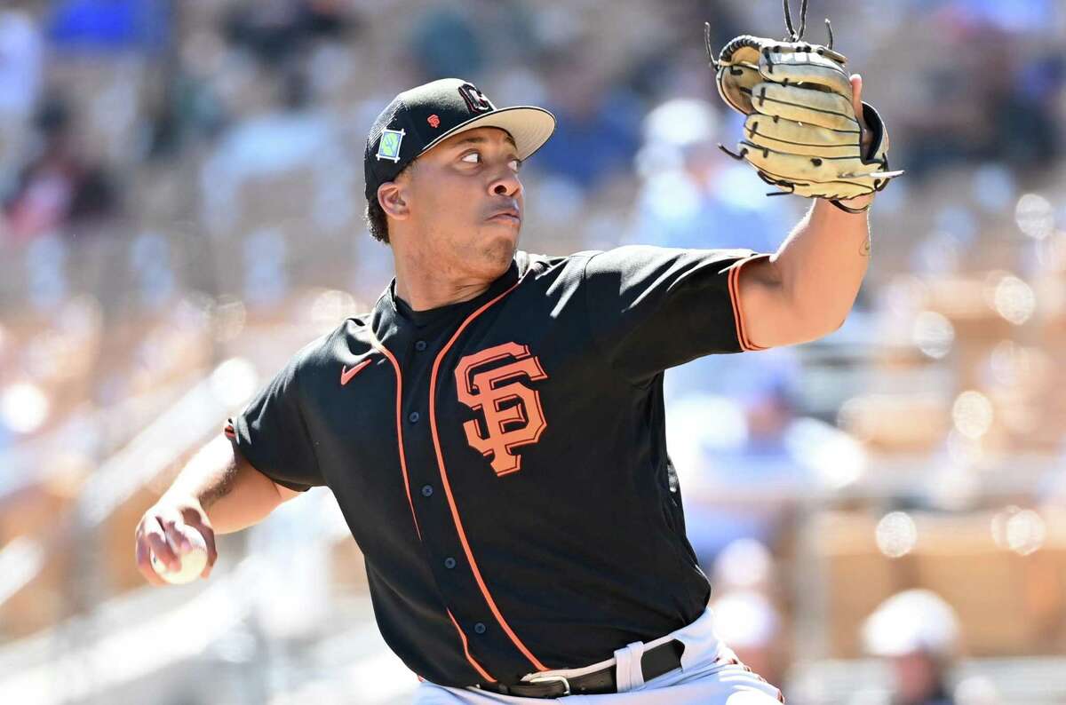 GLENDALE, ARIZONA - MARCH 24: Solomon Bates #98 of the San Francisco Giants delivers a pitch against the Chicago White Sox during a spring training game at Camelback Ranch on March 24, 2022 in Glendale, Arizona. (Photo by Norm Hall/Getty Images)