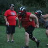 Reed City football coach Scott Shankel keeps an eye on his players during a Monday practice.