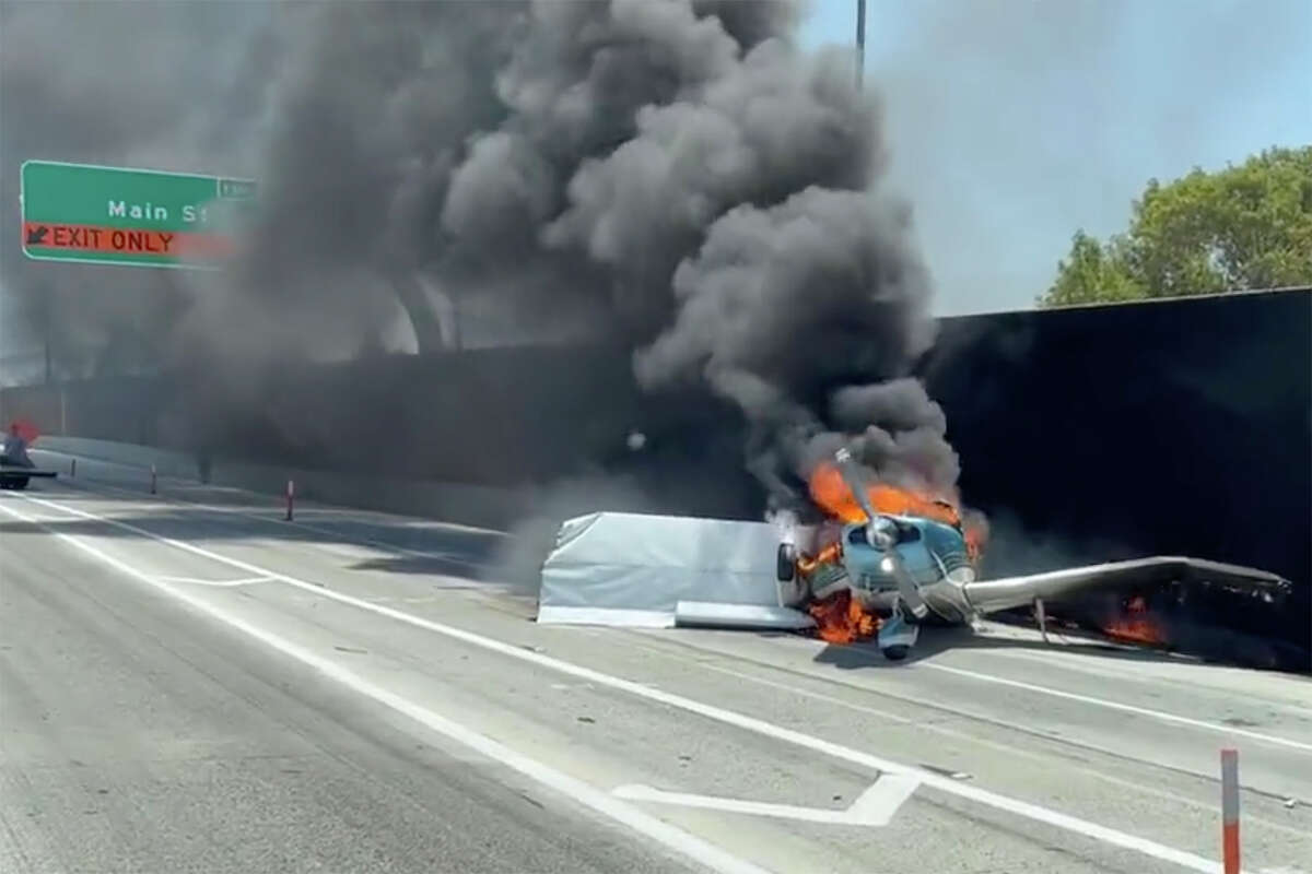 A small plane crashed on a Southern California freeway in Riverside County, 50 miles east of Los Angeles, Tuesday afternoon, striking a car and bursting into flames.