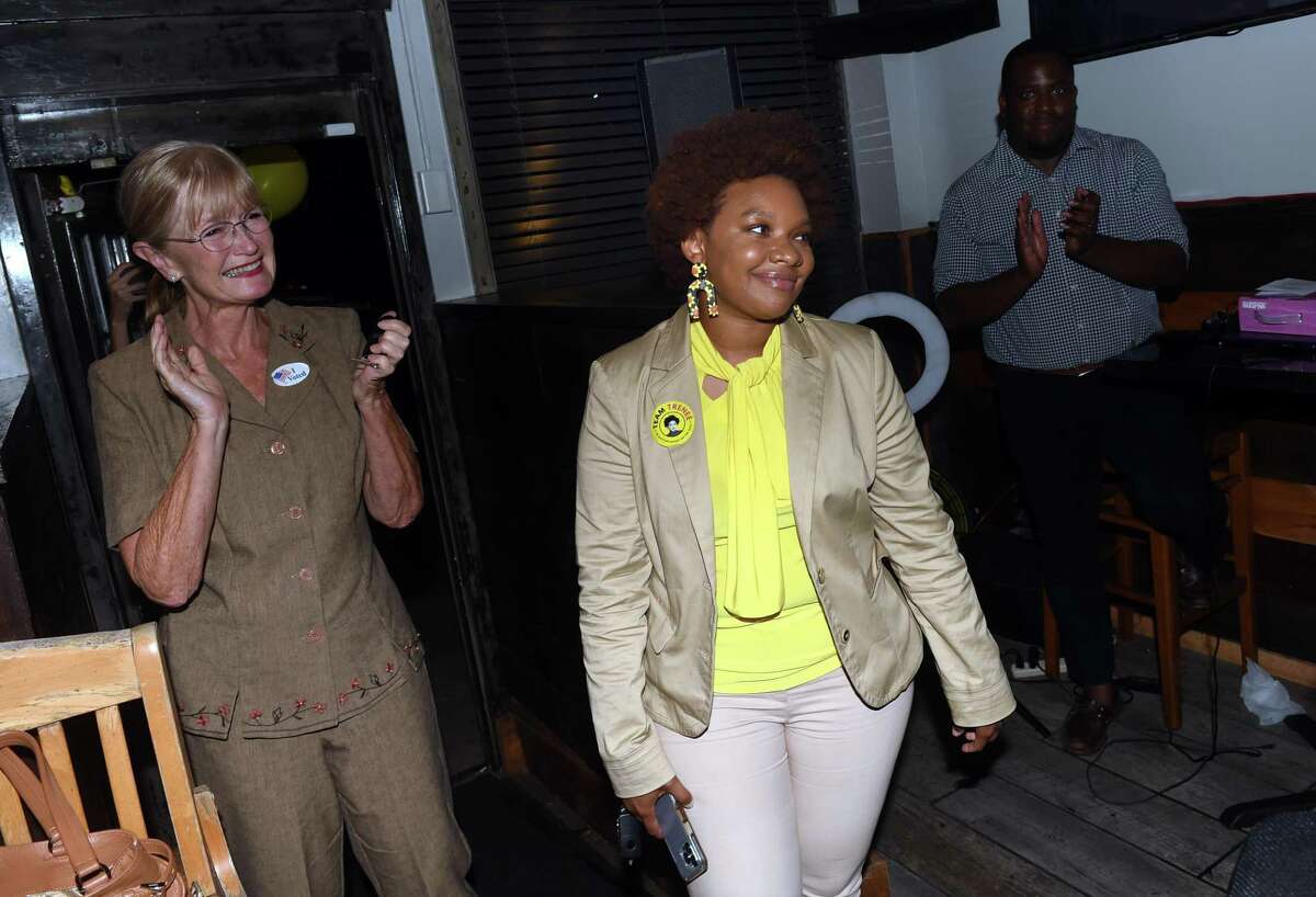 West Haven Mayor Nancy Rossi, left, joins Trenee McGee, center, to celebrate her primary victory at the Village Bar & Grill in West Haven on August 9, 2022.