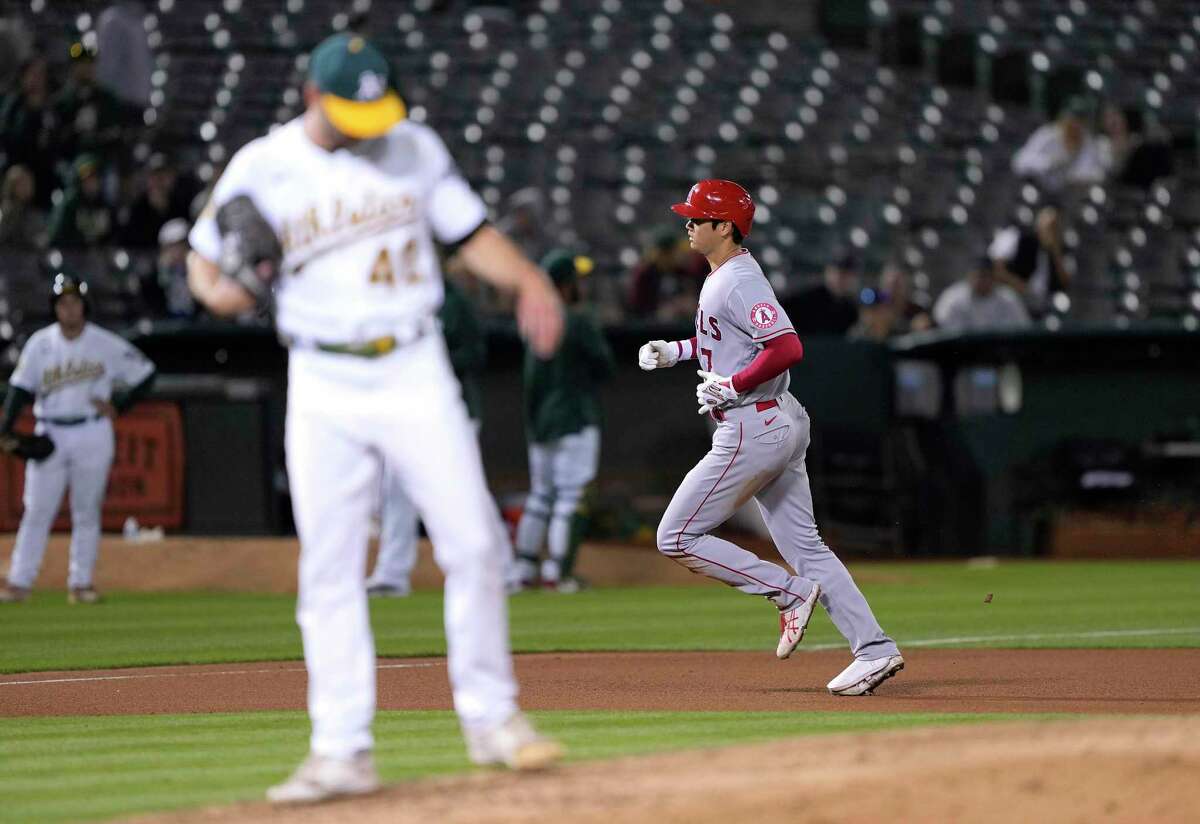 OAKLAND, CALIFORNIA - AUGUST 09: Shohei Ohtani #17 of the Los Angeles Angels trots around the bases after hitting a solo home run off of Sam Selman #40 of the Oakland Athletics in the top of the seventh inning at RingCentral Coliseum on August 09, 2022 in Oakland, California. (Photo by Thearon W. Henderson/Getty Images)