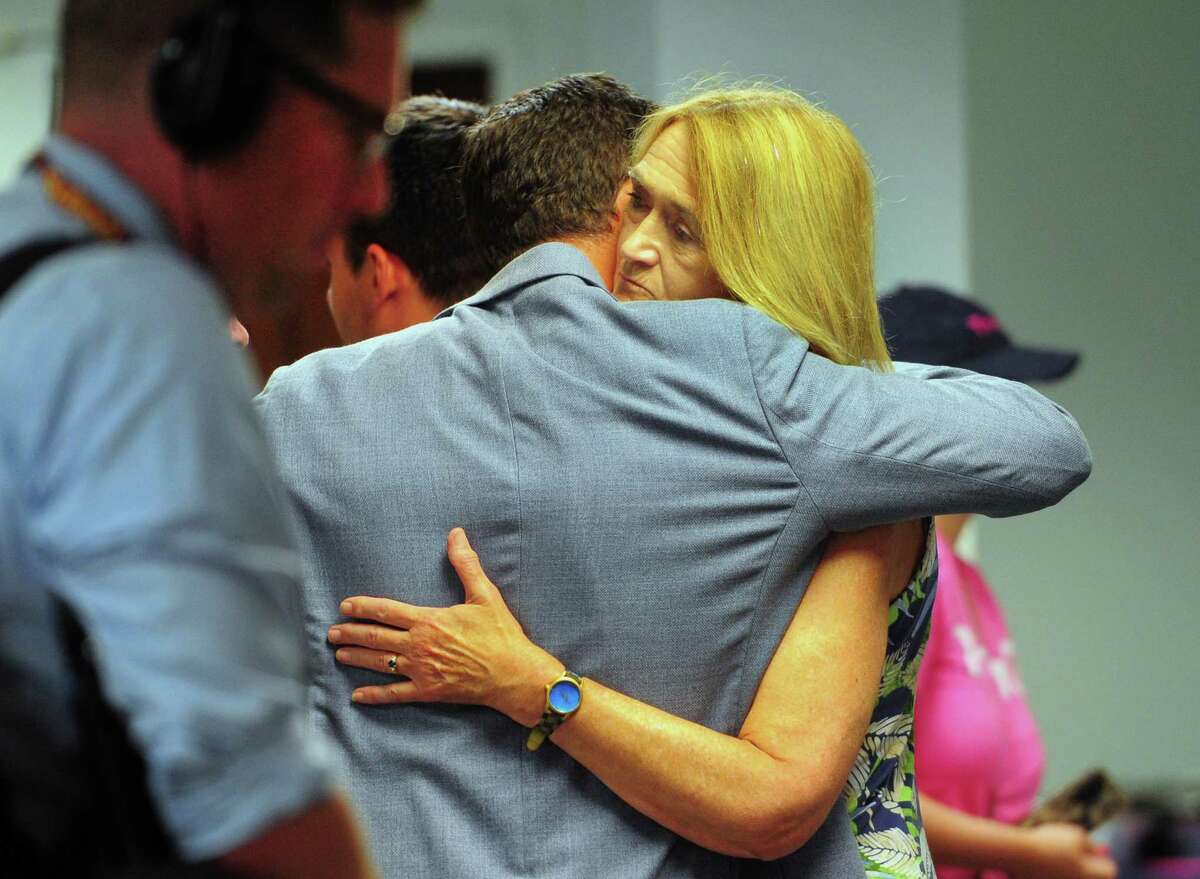 Supporters of Themis Klarides hug after Klarides gave a concession speech at her election headquarters in downtown Middletown, Conn., on Tuesday August 9, 2022. Klarides is in a U.S. Senate primary against candidates Leora Levy and Peter Lumaj.