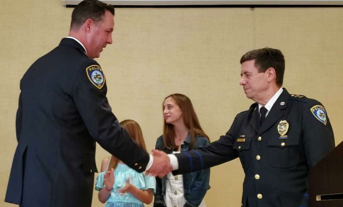 Capt. Jeremiah Marron, Jr. being honored at the Darien police promotion ceremony