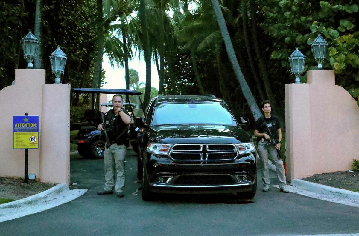 Secret Service agents stand at the gate of Mar-a-Lago after the FBI issued warrants to search former President Donald Trump’s home. Trump and other Republicans have argued the search is similar to Watergate — an absurd comparison.