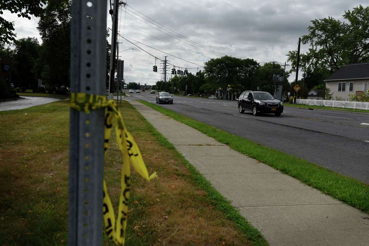 Police tape is tied to a street sign near where two pedestrians were killed Tuesday night at the intersection of Columbia Turnpike and Phillips Road on Wednesday, Aug. 10, 2022, in East Greenbush, N.Y.