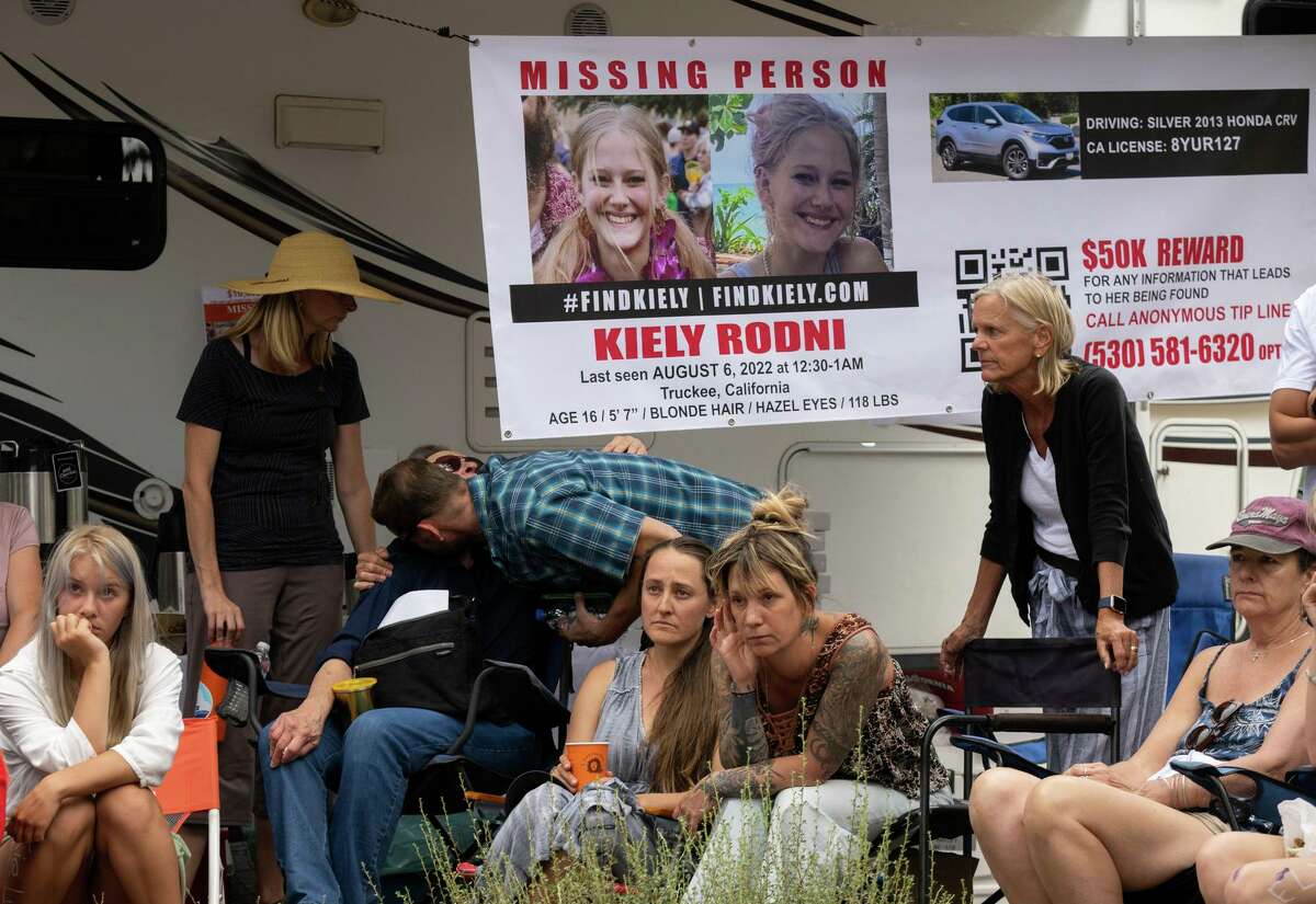 Lindsey Rodni-Nieman, center, mother of missing 16-year-old Kiely Rodni, listens to law enforcement during a news conference, Tuesday, August 9, 2022, in Truckee, Calif.