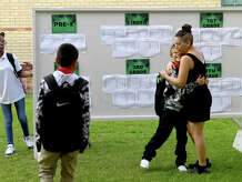 Martha Telles hugs her son Cain Gantan on the first day of school at Pietzsch - MacArthur Elementary in Beaumont. Photo made Wednesday, August 10, 2022. Kim Brent/The Enterprise