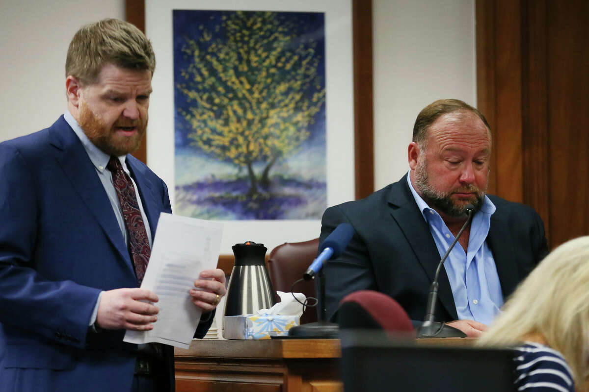 Mark Bankston, lawyer for Neil Heslin and Scarlett Lewis, asks Alex Jones questions about text messages during a trial at the Travis County Courthouse in Austin on Wednesday Aug.  3, 2022. 