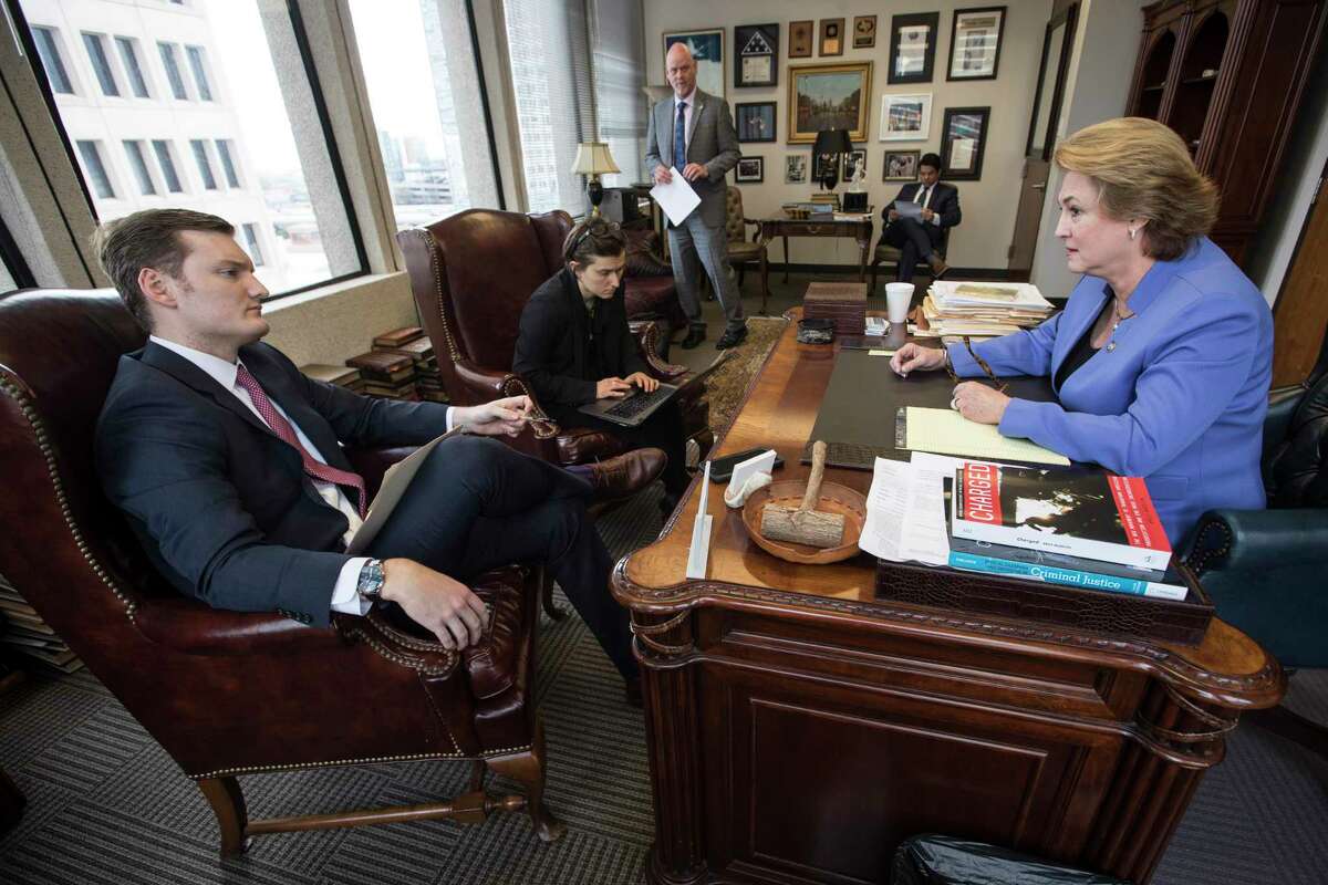 Former Houston Chronicle reporters Zach Despart, left, and Keri Blakinger interview Harris County District Attorney Kim Ogg on Wednesday, Feb. 6, 2019, in Houston.