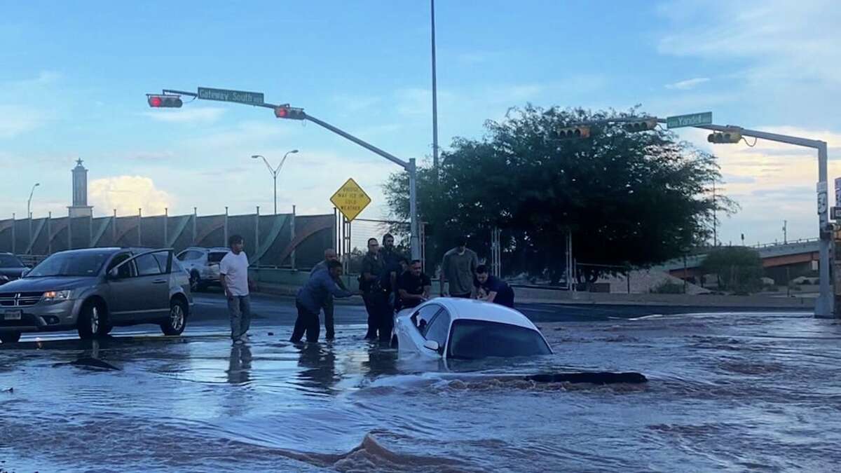A Texas woman was rescued before a sinkhole swallowed her car. 