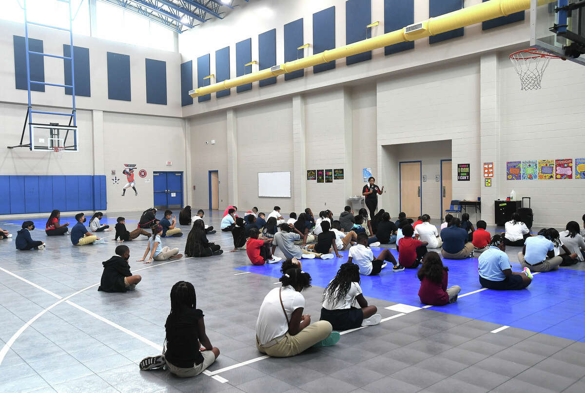 Physical Education teacher Joy Guillory talks with fifth graders about the protocol for class on the first day of school at DeQueen Elementary in Port Arthur. Photo made Wednesday, August 10, 2022. Kim Brent/The Enterprise