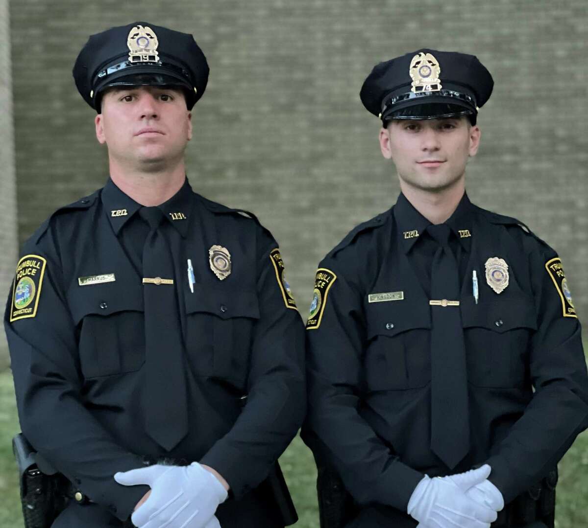 From left to right, Trumbull Police recruits Colin Markus and Jack Kingdon, who recently graduated from the Bridgeport Police Academy.