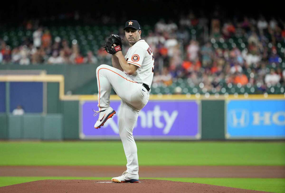 Houston Astros starting pitcher Justin Verlander (35) pitches to Texas Rangers Marcus Semien (2) during the first inning of an MLB game at Minute Maid Park on Wednesday, Aug. 10, 2022 in Houston.