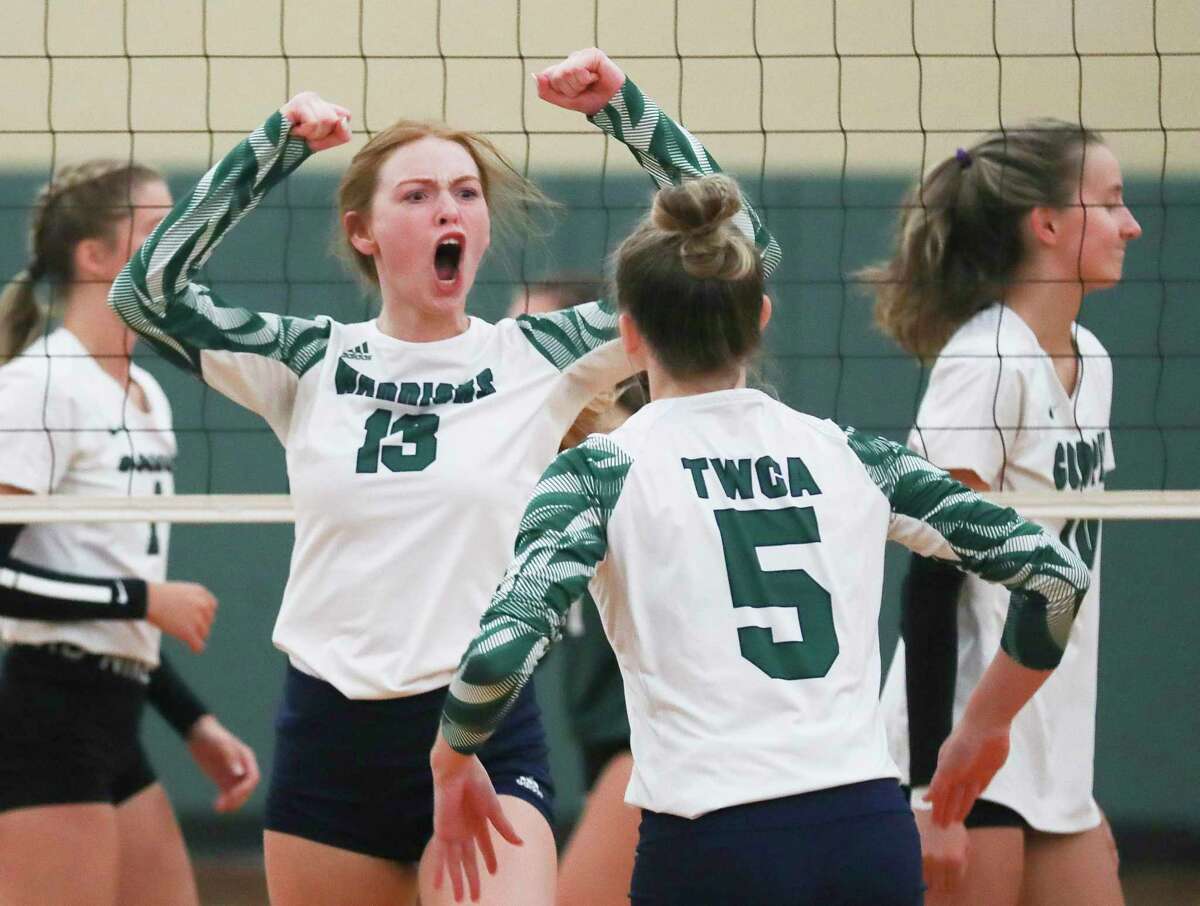 The Woodlands Christian Academy's Kirstyn Montgomery (13) reacts after blocking a shot in the first set of a non-district high school volleyball match at The John Cooper School, Wednesday, Aug. 10, 2022, in The Woodlands.