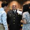 Louis DeRubeis receives his pin from his family as he is promoted to Assistant Police Chief at the Stamford Police Department in 2021. DeRubeis has just been named Stamford’s Director of Public Safety.