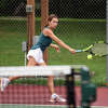 Edwardsville's Gabi Hill reaches for a shot during a practice match on Tuesday inside the EHS Tennis Center.