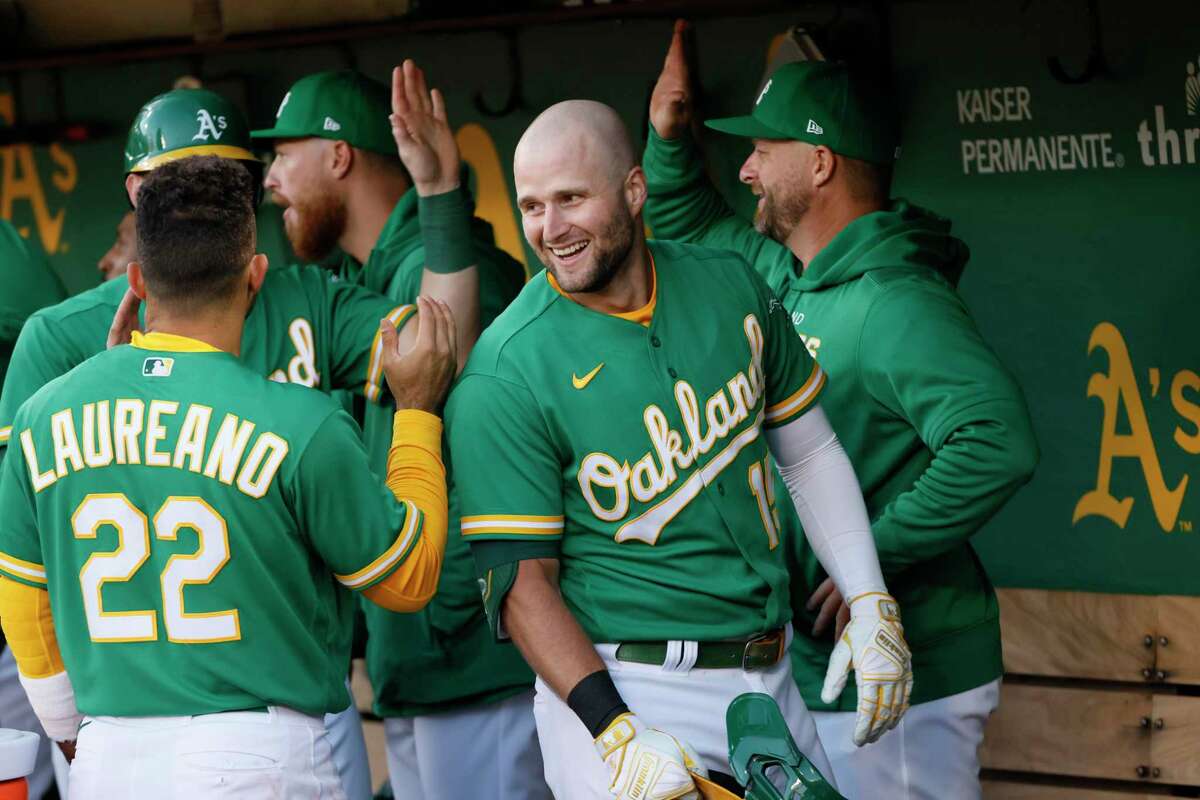 Athletics first baseman Seth Brown (center), who leads Oakland with 17 home runs, has hit seven homers and is slugging .837 in 15 games since the All-Star break.