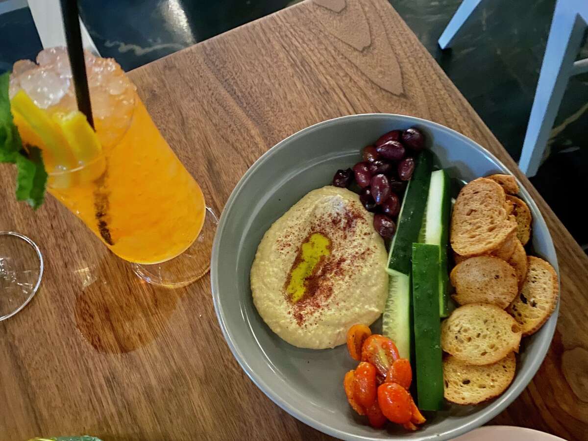 Sojourn, a downtown cocktail bar with a cold kitchen menu, is in its soft opening phase at 244 W. Houston St.