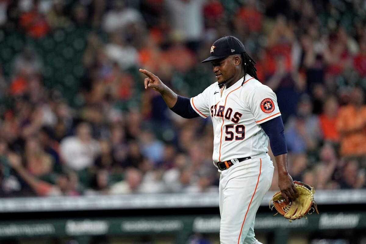 Houston Astros starting pitcher Framber Valdez walks toward the dugout after striking out Texas Rangers' Bubba Thompson during the seventh inning of a baseball game Thursday, Aug. 11, 2022, in Houston. (AP Photo/David J. Phillip)
