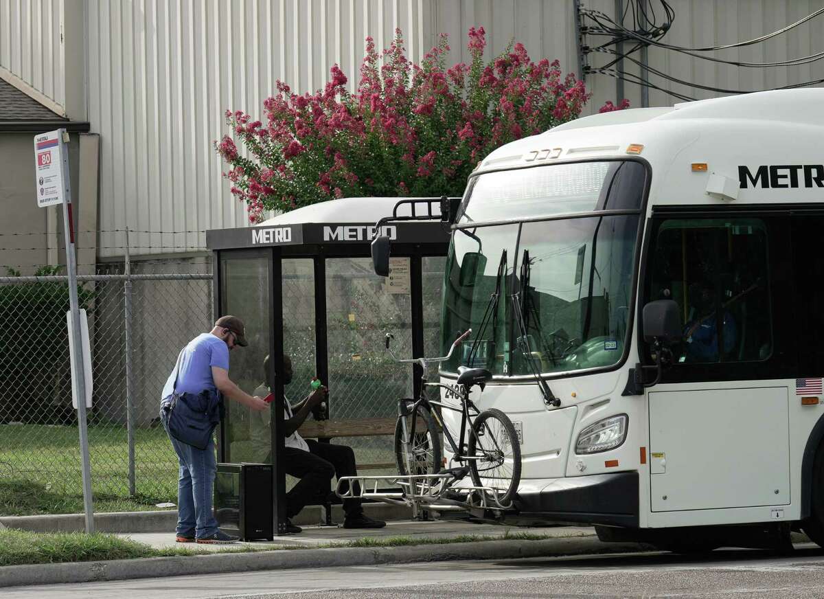 A 80 MLK-Lockwood bus picks up a rider at Lockwood Drive and Harrisburg Boulevard Thursday, July 21, 2022, in Houston. Metropolitan Transit Authority is receiving $21.6 million to replace 20 of its diesel buses with electric models.