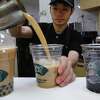 An employee at Ten Ren Tea in Queens, N.Y., pours servings of popular bubble tea, which features tasty pearls of flavored tapioca that can be slurped up with a large straw.