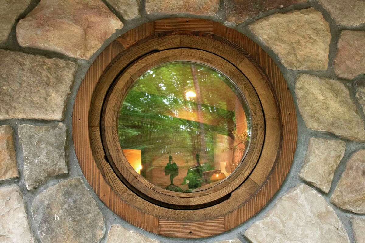Window in The Hobbit House at June Farms on Wednesday, Aug. 10, 2022 in West Sand Lake, N.Y. The Hobbit House is one of many theme based Airbnb rental units on June Farms owned by Matt Baumgartner.