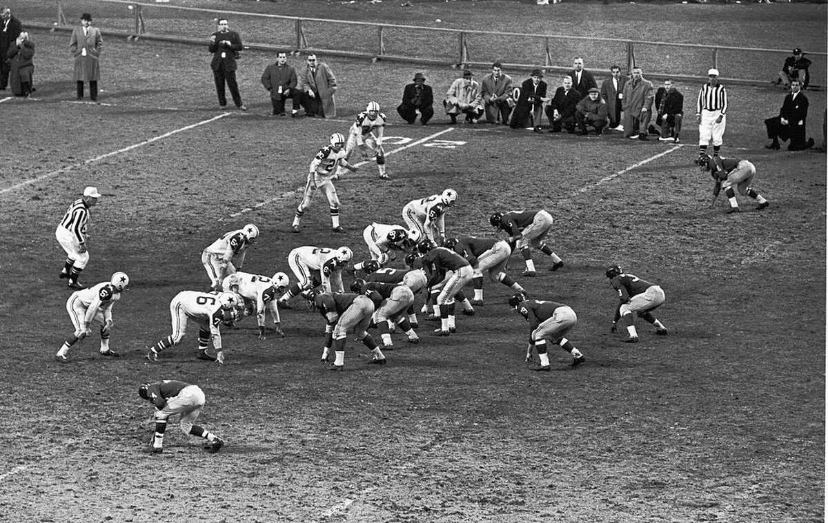 The Dallas Cowboys played their first-ever game in front of Texas fans on Aug. 13, 1960, in San Antonio. In this photo, the Cowboys take on the New York Giants later that season. 