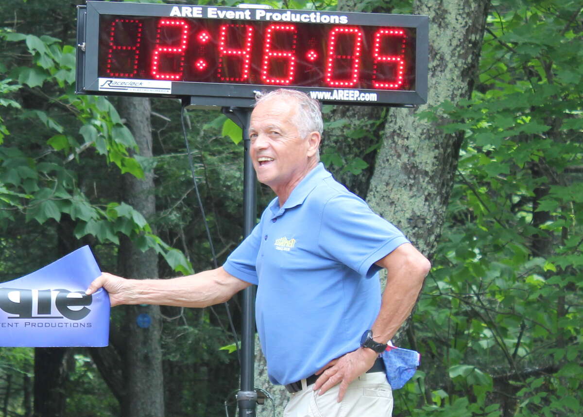 Dick Vincent at the finish line of this year’s Escarpment Trail Run, which he founded in 1977.