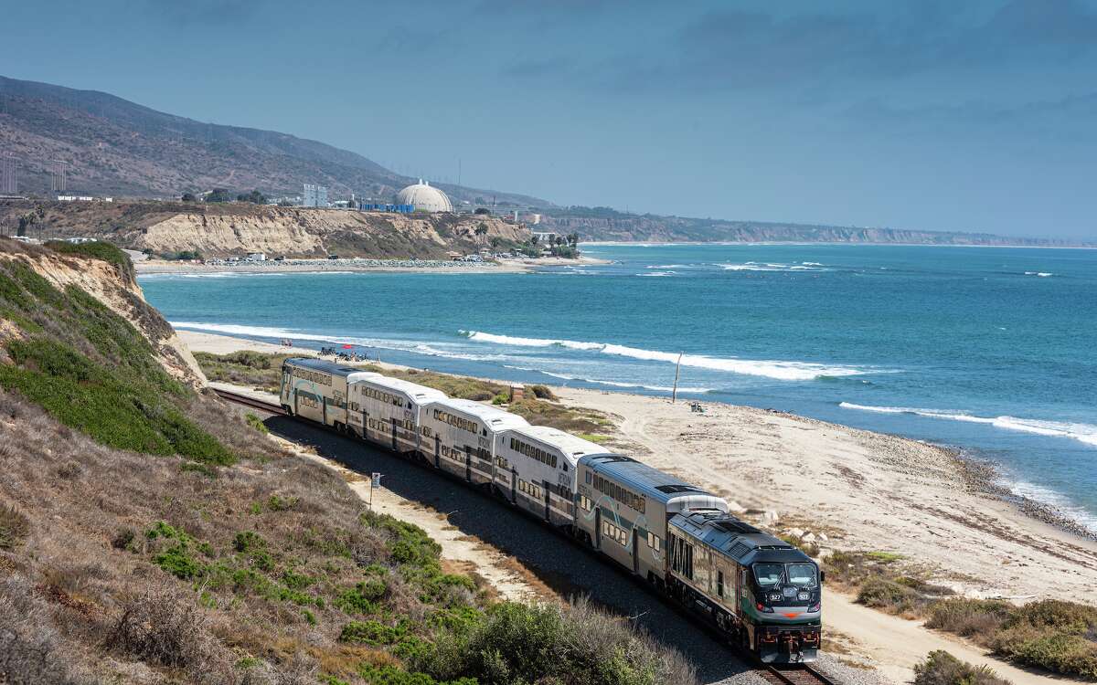 A south-bound Metrolink train passes through San Onofre State Beach near Lower Trestles in San Clemente in August 2019. 