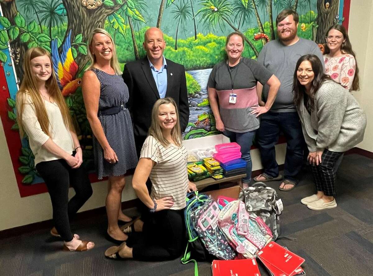 State Sen. Kris Tharp, D-Bethalto, on Tuesday delivered school supplies to the Madison County Child Advocacy Center in Wood River. From left are Lauren Pearman, Carrie Cohan, Tharp, Jaclyn Hunziker, Katie Klaas, Neil Lipe, Jennifer Kampwerth (squatting down) and Beth Buerke.