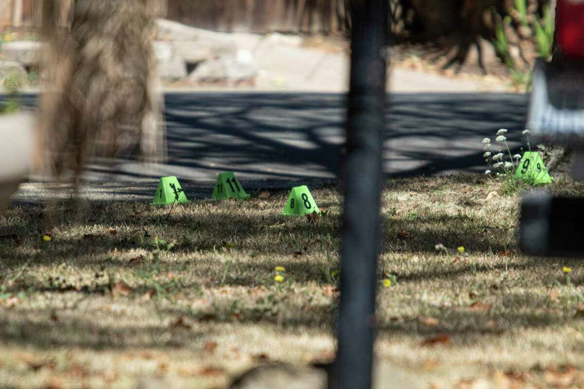 Evidence markers on a lawn as Vallejo police investigate a shooting death in the 1300 block of Arkansas St. in Vallejo, Calif., Friday, August 12, 2022.