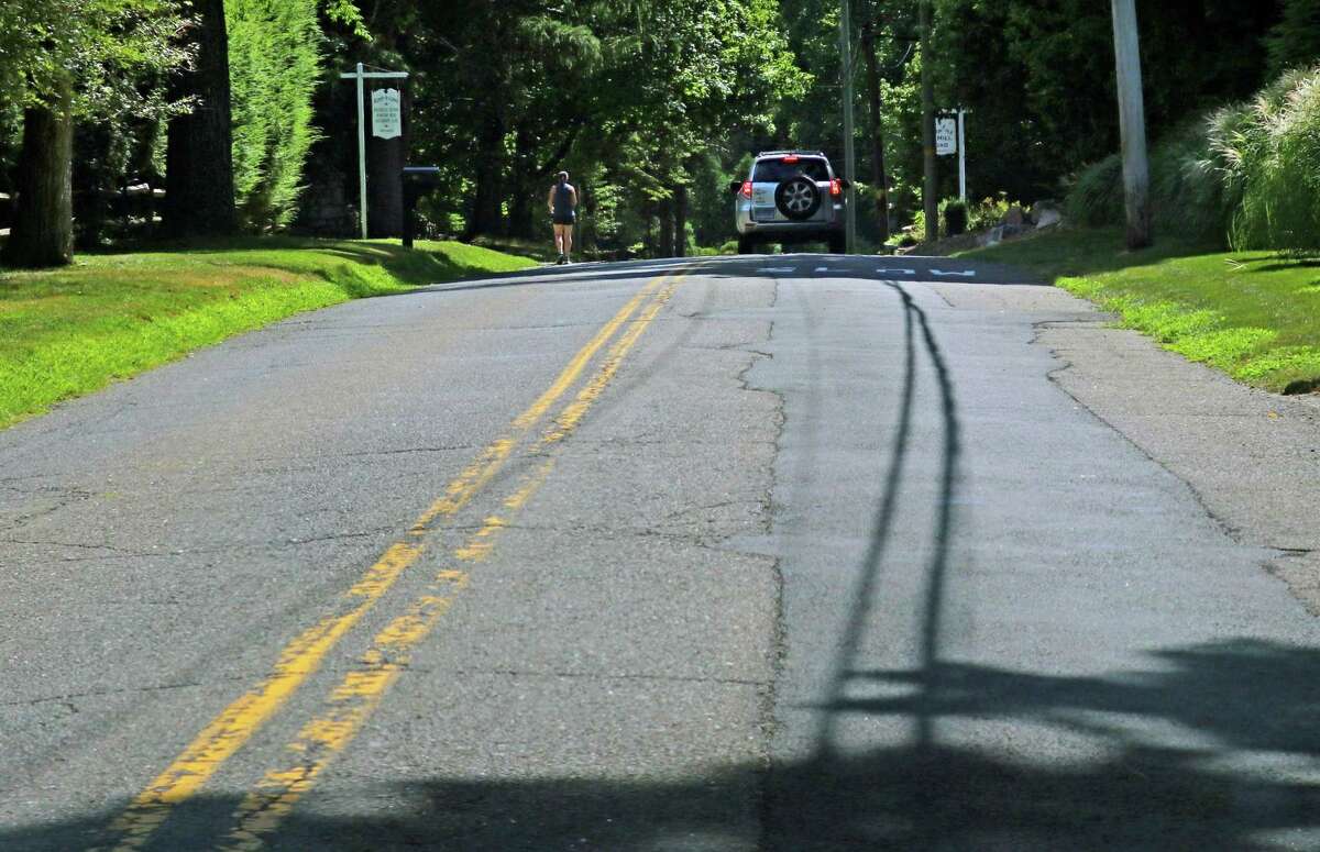 A view of a bad section of Christie Hill Road in Darien, Conn., on Friday August 12, 2022.