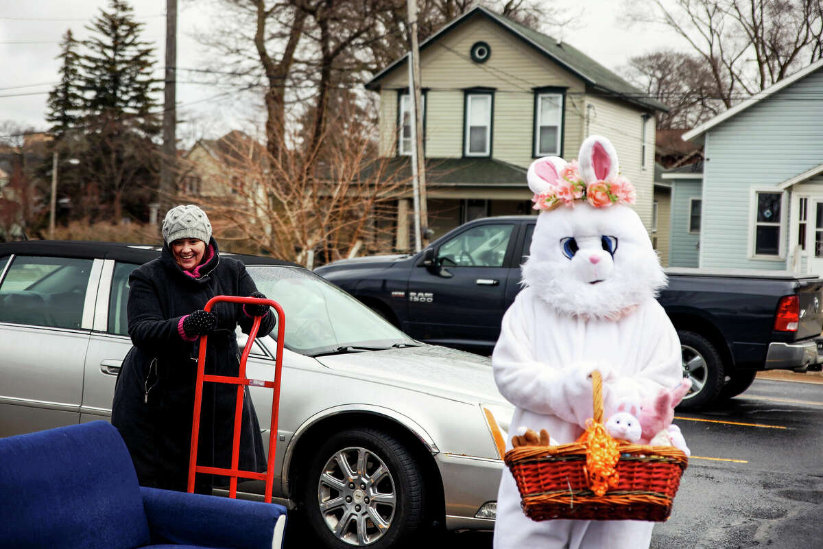 In this file photo, Angela Fischer and the Easter Bunny pose for a picture as they wrap-up drive-thru celebration of spring at the Manistee County Library.