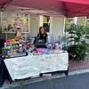 From left, Beckett Cardonsky, 8, and Penelope Cooper, 9, set up their Loom Bands business in front of the Bridgewater Village Store on July 30 to raise money to benefit the New Milford Animal Welfare Society.