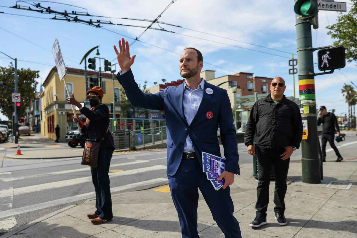 Chesa Boudin canvasses in San Francisco’s Bayview neighborhood in June in his unsuccessful bid to keep his job as district attorney in the recall election.