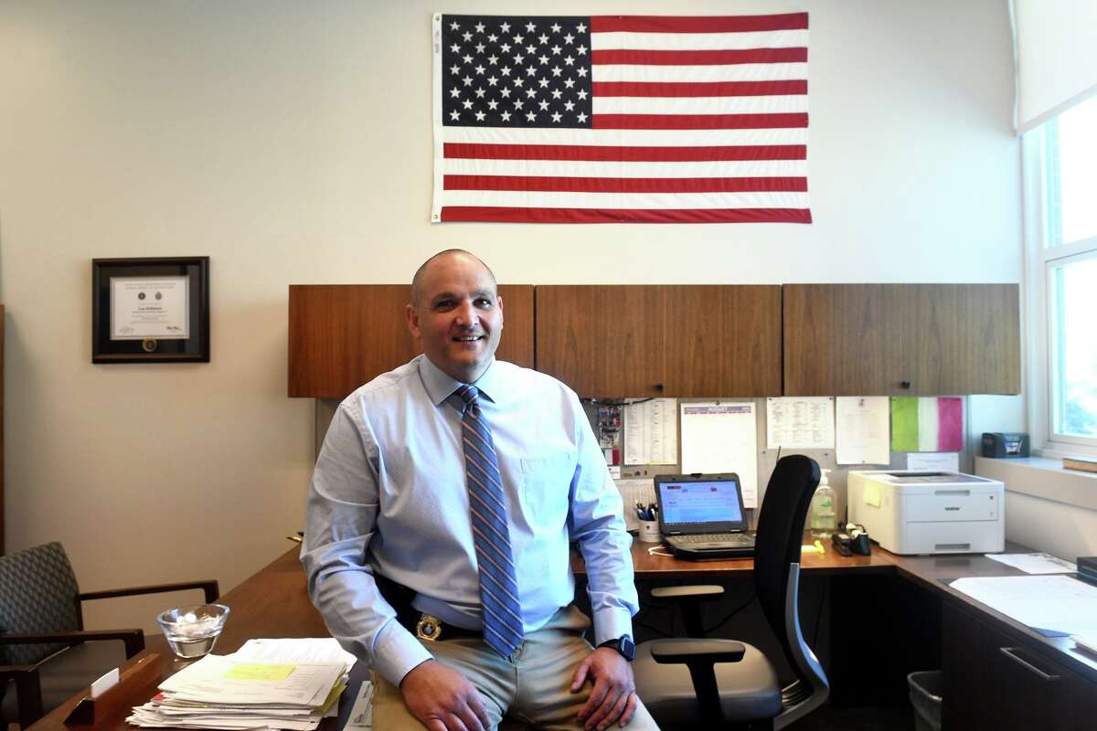 Assistant Chief Louis DeRubeis poses in his office at Stamford Police Headquarters, in Stamford, Conn. Aug. 12, 2022. DeRubeis had been named the City of Stamford’s new Director of Public Safety, Health, and Welfare.