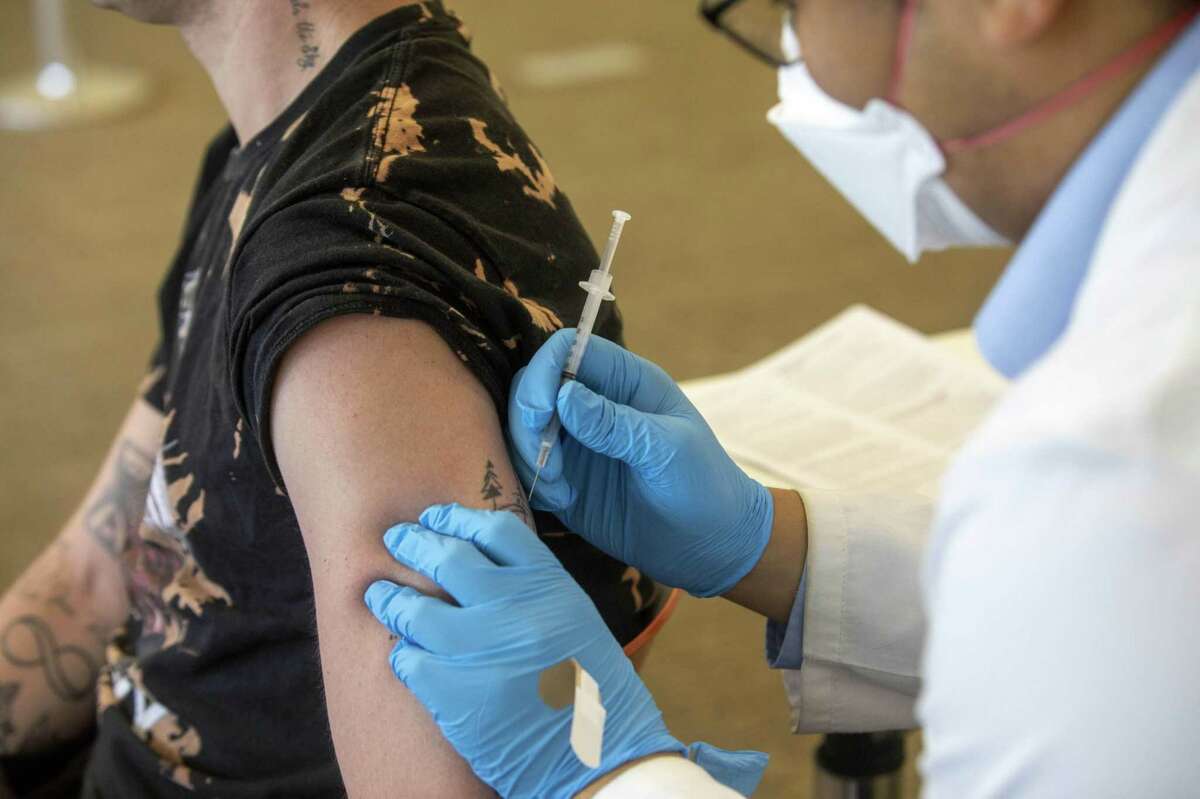 A health worker administers a dose of the Bavarian Nordic Jynneos monkeypox vaccine at a vaccination site in West Hollywood, Calif., on Aug. 3.