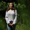 Katie Wee, 33, stands for a portrait off a hiking trail near her parent’s home in Tahoma, Calif. on Thursday, Aug. 11, 2022. Wee said being in nature has helped her as she continues to heal from sexual abuse at 12 years old. Wee was abused by her ballet teacher Viktor Kabaniaev, a famed Russian ballet dancer and employed by Contra Costa ballet studio. The abuse lasted until she was 16. Wee was reluctant to come forward to her family and police until one day she realized she needed to stop Kabaniaev from abusing other students. In her late 20s she approached police and wore a wire while meeting Kabaniaev at a coffee shop in Walnut Creek. He confessed to the abuse and now is serving 20 years in state prison for her abuse and other victims. During the criminal trial she was called “Jane Doe 1.” But now Wee is coming forward to tell her story with her real name and show her face for the first time.