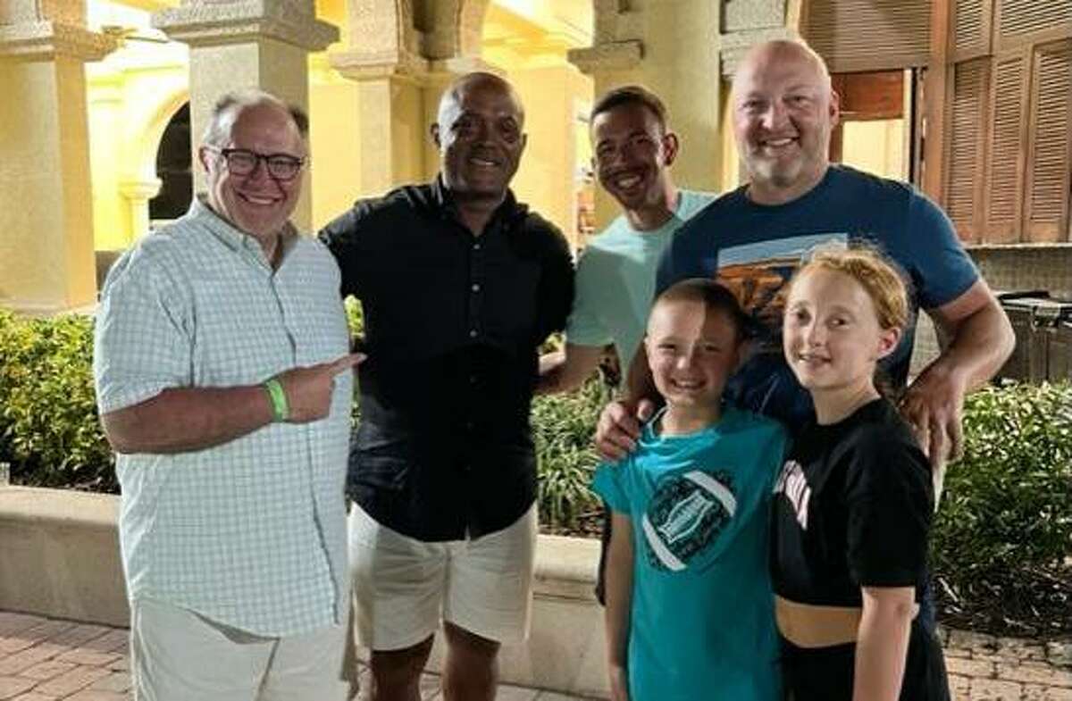 From left, Norwalk bakery owner Sky Mercede Sr., left, meets up with former NFL running back Brian Mitchell, along with Sky Mercede II, Paul DelGreco, Tate DelGreco and Lilly DelGreco, in Palm Coast, Fla.