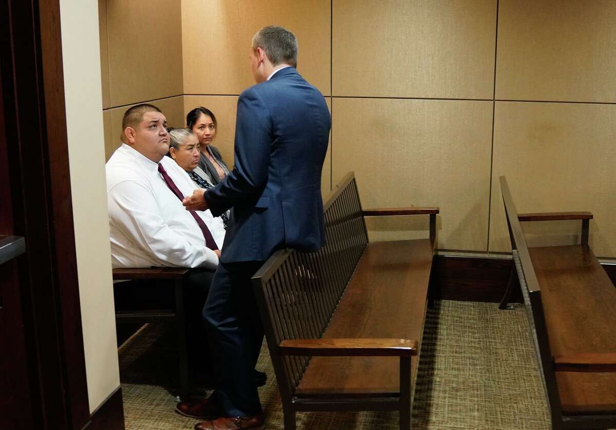 Defendant Rafael Castillo talks with attorney Matt Allen in the back of the courtroom as his murder trial continued Friday in the 290th District Court.