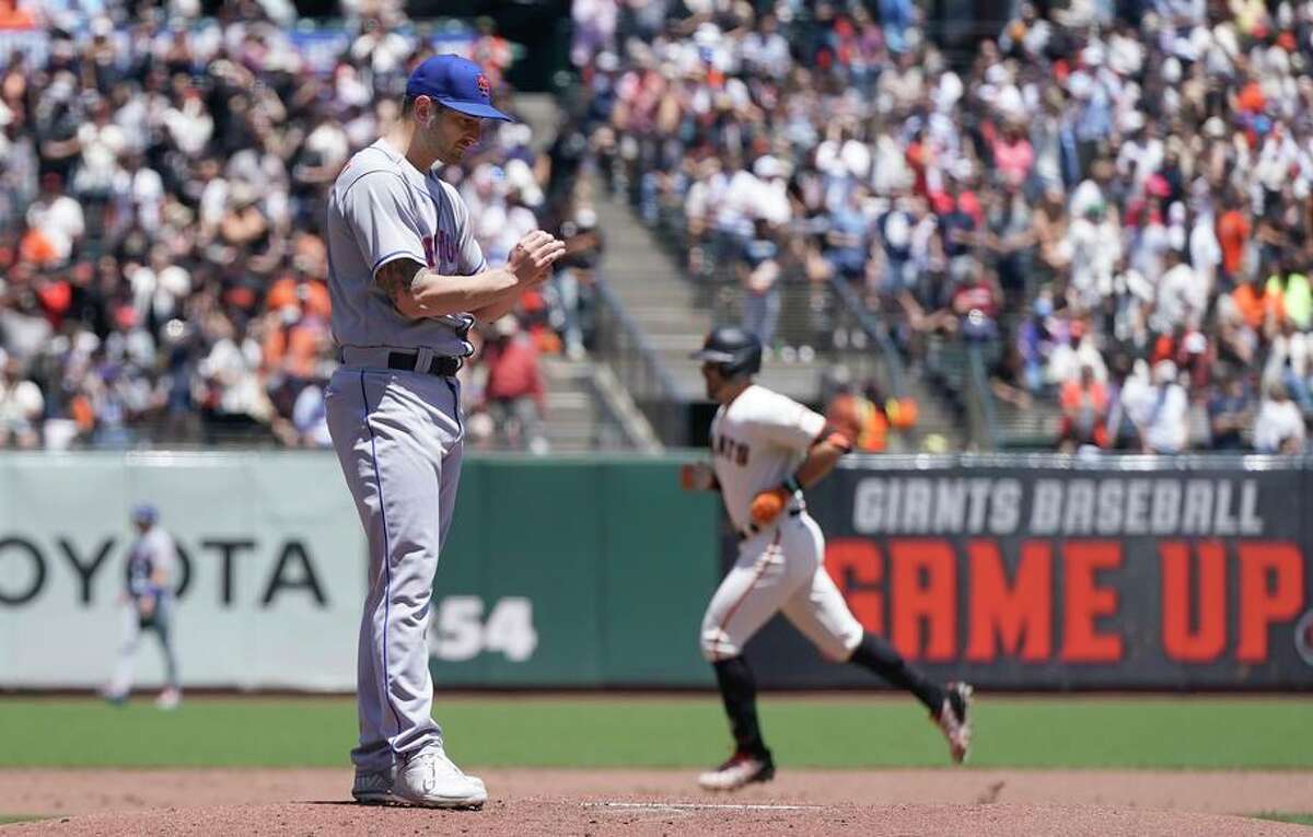 San Francisco Giants' Evan Longoria, right, rounds the bases after hitting a home run off of New York Mets pitcher Thomas Szapucki, foreground, during the second inning of a baseball game in San Francisco, Wednesday, May 25, 2022. (AP Photo/Jeff Chiu)
