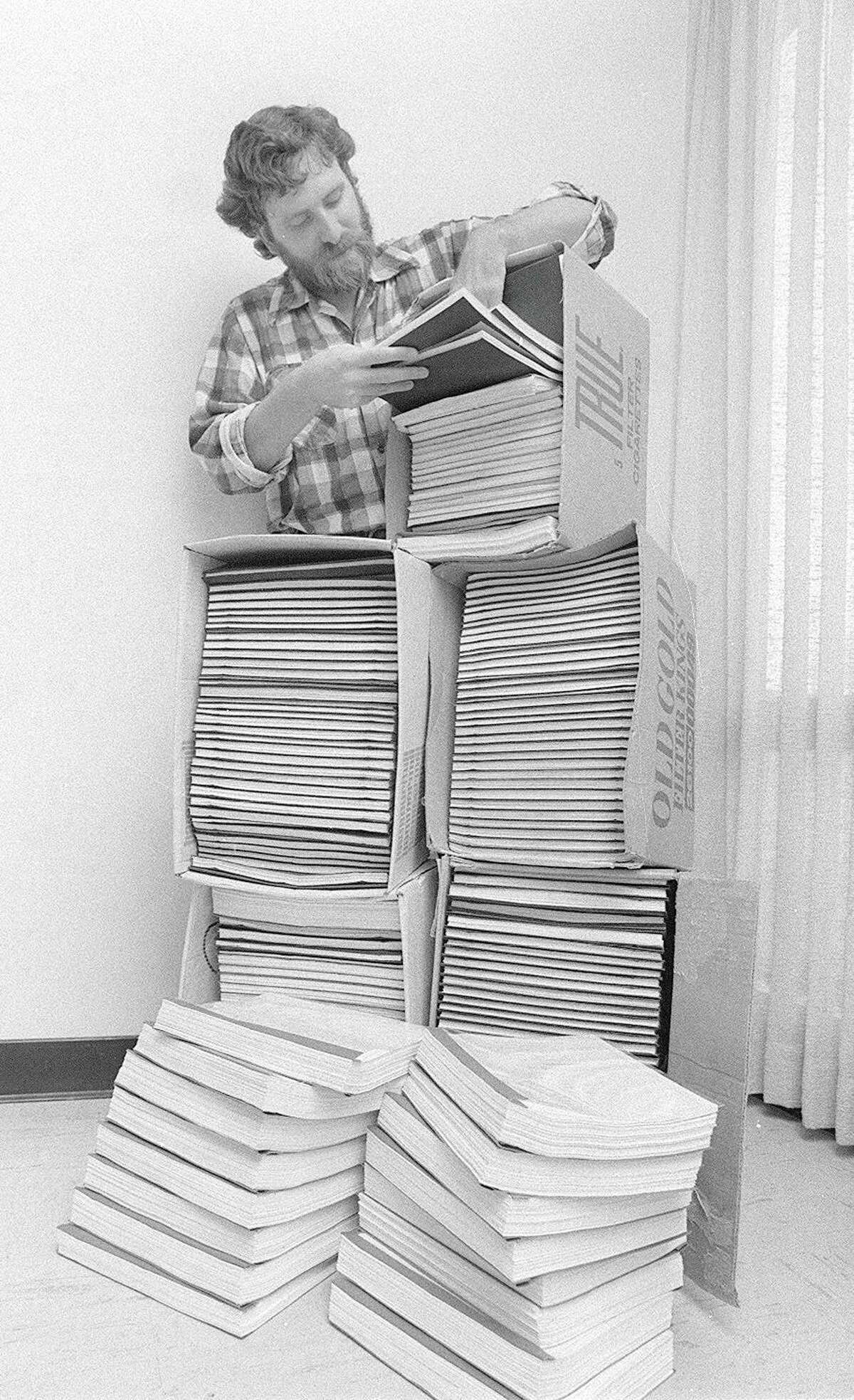 Dennis Riordan in 1977 with stacks of transcripts from the San Quentin State Prison escape trial. Riordan passed away on Thursday after a seven-year battle with cancer.