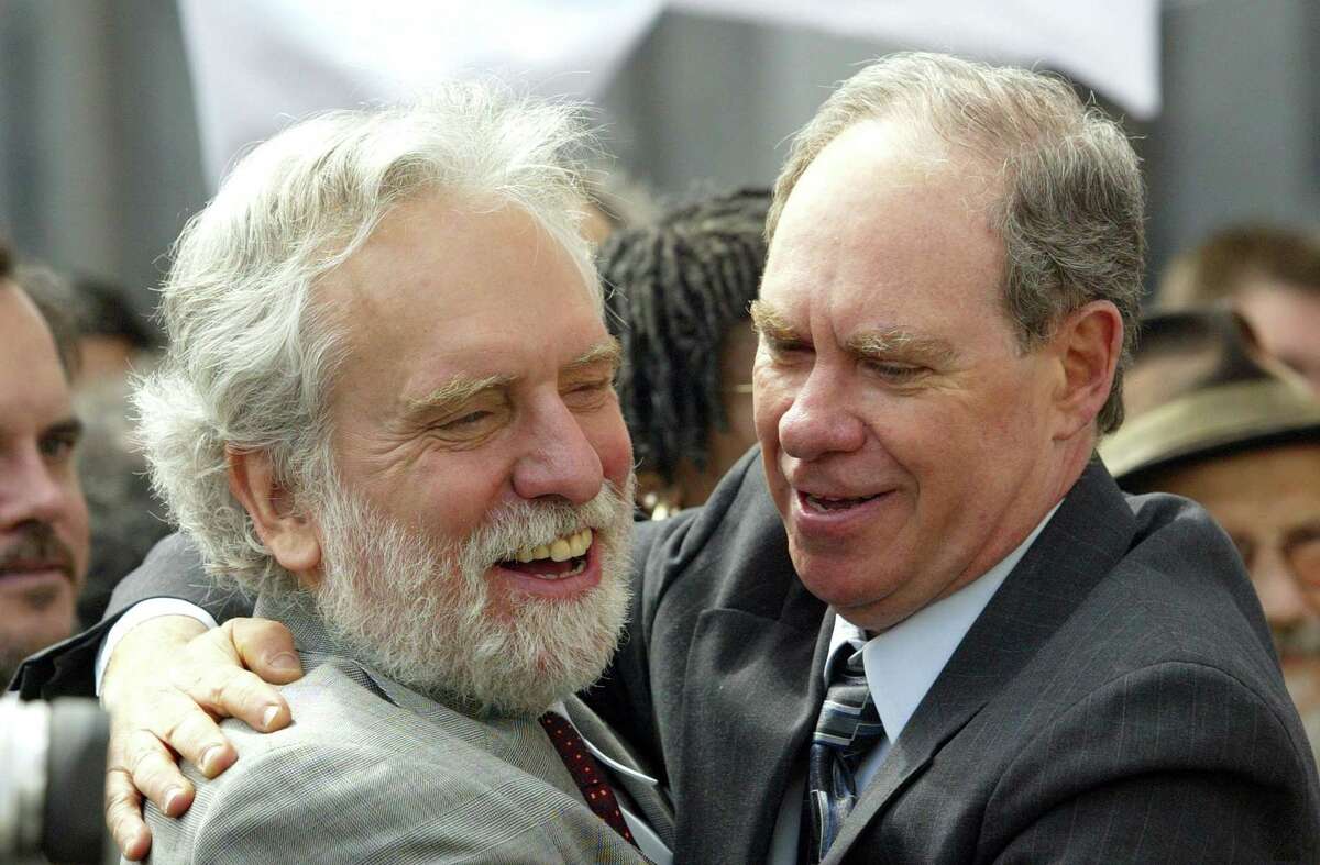 Medical marijuana grower Ed Rosenthal (right) hugs attorney Dennis Riordan as they leaves the San Francisco Federal building in June 2003. Rosenthal, the self-proclaimed "Guru of Ganja" walked free Wednesday after a federal judge sentenced him to one day in prison for a marijuana cultivation.