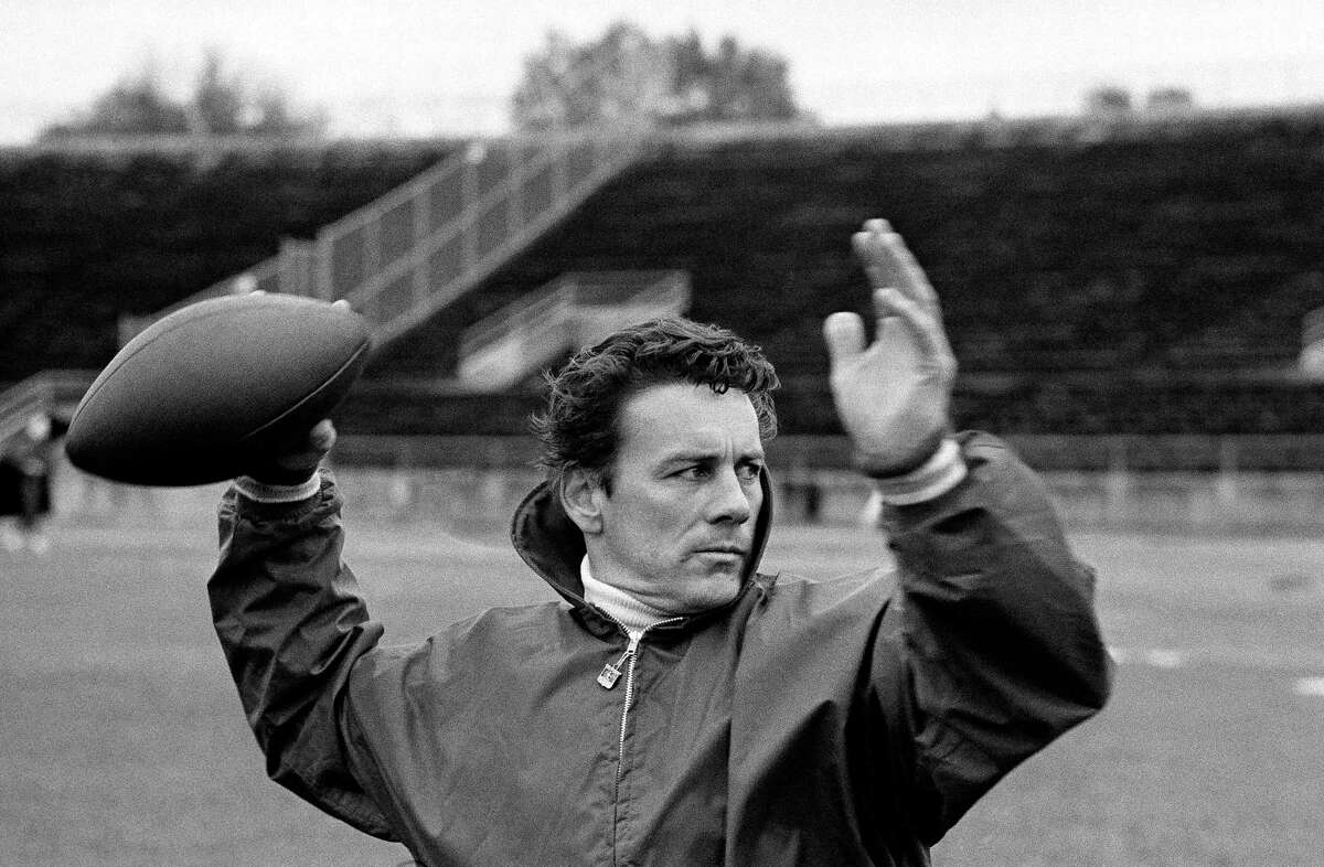 FILE - Len Dawson of the Kansas City Chiefs running through passing drills with receivers in New Orleans to prepare for the Super Bowl, in January 1970. Dawson, the 87-year-old Hall of Fame quarterback who led the Chiefs to their first Super Bowl title, has entered hospice care in Kansas City, Mo. KMBC-TV, the Kansas City station where Dawson began his broadcasting career in 1966, confirmed Dawson is in hospice care through his wife, Linda.