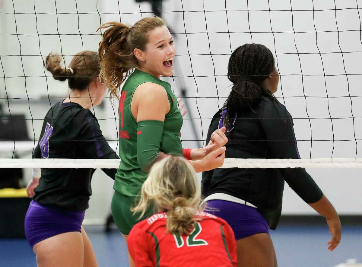 The Woodlands' Bella Haden (4) reacts after a block in the first set of a non-district high school volleyball match during the Adidas John Turner Classic, Friday, Aug. 12, 2022, in Webster.
