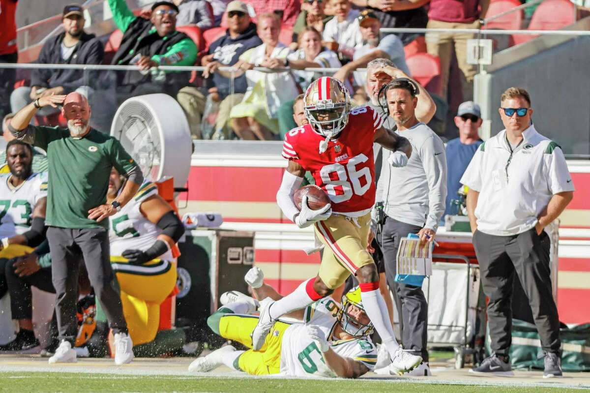 San Francisco 49ers wide receiver Danny Gray (86) breaks the tackle by Green Bay Packers safety Dallin Leavitt (6) and runs into the end zone for a touchdown in the first quarter of an NFL preseason game against the Green Bay Packers at Levi's Stadium, Friday, Aug. 12, 2022, in Santa Clara, Calif.