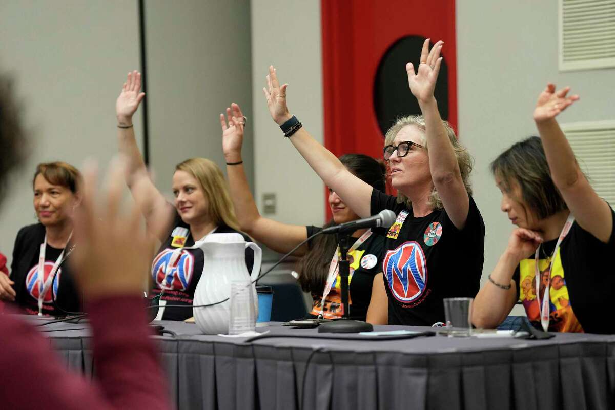 MomsRising.org CEO Kristin Rowe-Finkbeiner raises both hands as she engages with the audience during a session titled The Care Infrastructure, Abortioncare & How We Need Both!, Saturday, Aug. 13, 2022, in Houston. The talk took place at the 2022 Women’s Convention in Houston.