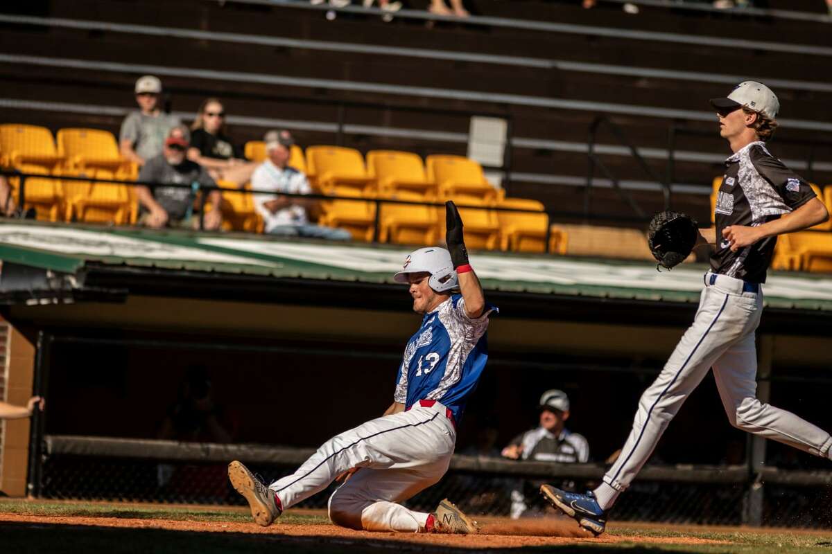 Berryhill Post 165's Tanner Sonntag scores on a wild pitch during Saturday's game against Omaha (Neb.) at the American Legion Baseball World Series in Shelby, N.C., Aug. 13, 2022.